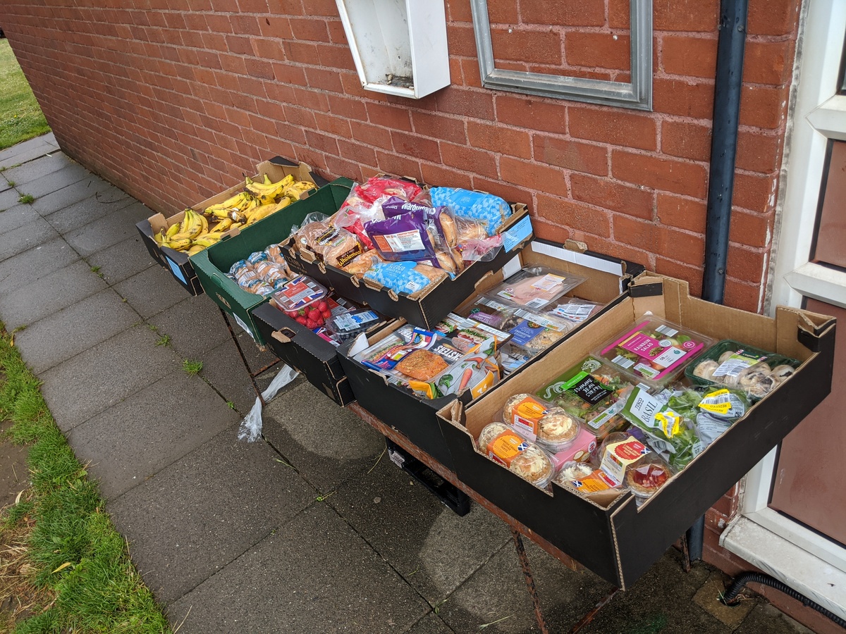 Surplus food left outside the hall for anyone in need